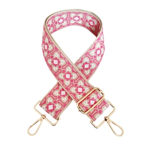 Close-up of pink geometric jacquard bag strap with adjustable gold alloy hooks
