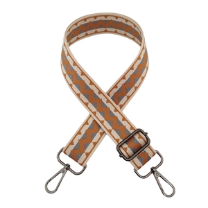 Detail of adjustable 3.8cm wide bag strap with orange and grey zigzag weave pattern