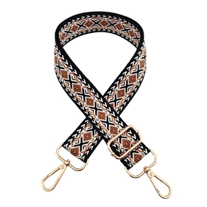 Close-up of bohemian geometric diamond woven strap with premium gold lobster clasps