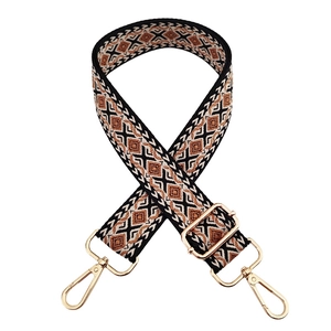 Close-up of bohemian diamond pattern bag strap with adjustable gold swivel metal hooks