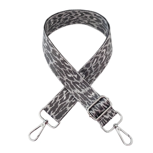 Close-up of leopard print shoulder strap with adjustable silver metal lobster claw hooks