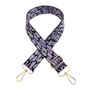 Detail of adjustable purple leopard print strap with gold metal lobster clasps