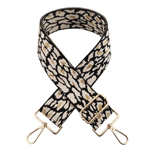 Adjustable leopard print bag strap with gold glitter accents and metallic buckles
