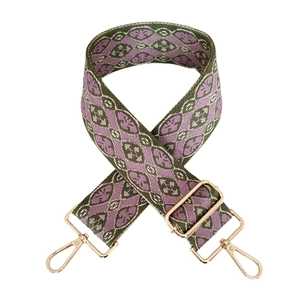 Detail des grün-violetten geometrischen Webriemens mit goldenen Metallschnallen