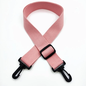 Close-up of pink woven cotton replacement shoulder strap with black plastic swivel hooks