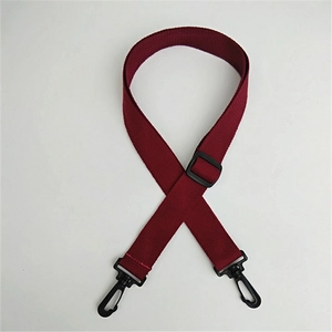 Close-up of burgundy woven replacement shoulder strap with black plastic swivel hooks