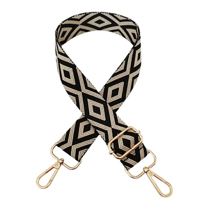Black and white geometric diamond woven bag strap with light gold metal lobster clasps