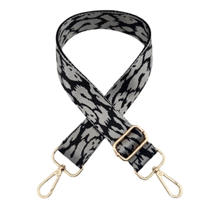 Adjustable nylon shoulder strap with grey leopard print and gold metal buckles