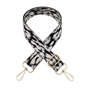 Adjustable woven canvas bag strap with black and white animal print and gold metal clips