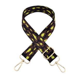 Detail of 3.8cm leopard jacquard strap with neon green accents and gold metal hooks