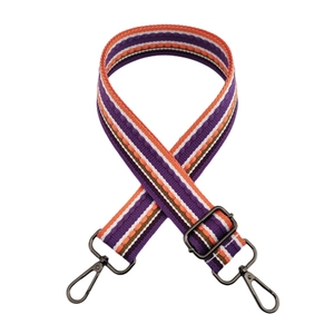 Detail of adjustable colorful striped shoulder strap with vintage woven pattern and metal hooks