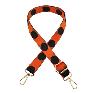 Adjustable 2.5cm orange shoulder strap with black polka dots and gold metal hooks