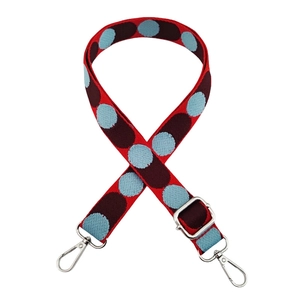 Close-up of adjustable colorful polka dot replacement strap with silver metal hooks