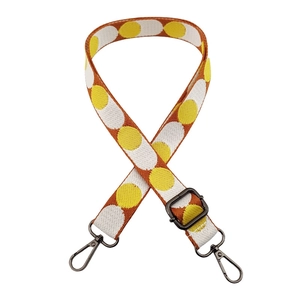 Adjustable bag strap with colorful polka dot pattern and dark metal swivel hooks