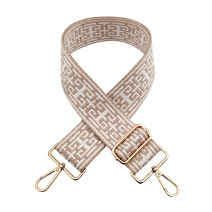 Ethnic style geometric jacquard bag strap with gold metal hooks on white background