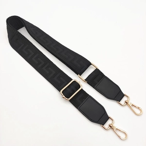 Adjustable black jacquard shoulder strap with geometric pattern and gold hardware