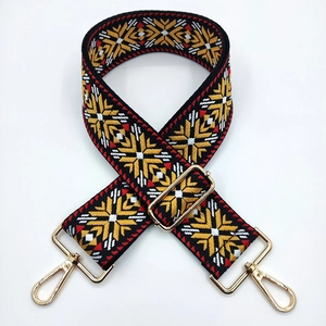 Ethnic style embroidered handbag strap with geometric patterns and gold metal buckles