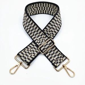 Detailed view of 5cm ethnic jacquard wide shoulder strap with gold metal swivel snap hooks