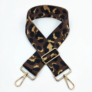 Detail view of 5cm ethnic leopard print wide strap with gold metal lobster clasps