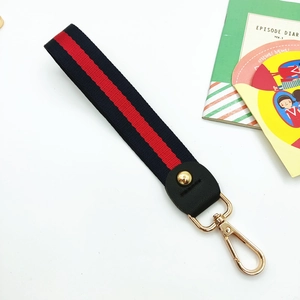 Nautical navy and red striped wristlet strap with gold lobster clasp and leather trim