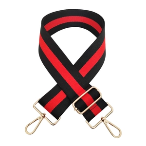 Adjustable wide striped canvas strap with red and black pattern and gold metal clips