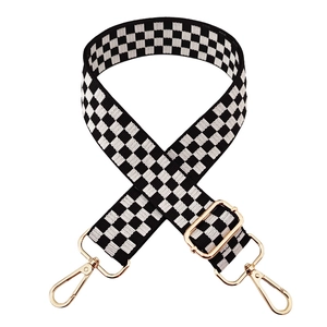 Adjustable black and white checkerboard nylon shoulder strap with gold metal lobster clasps