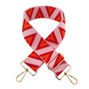 Adjustable wide jacquard bag strap with pink, orange, and red geometric patterns