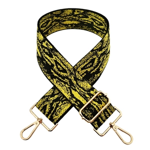 Adjustable wide snake pattern bag strap with yellow snake print and gold hardware