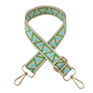 Ethnic wide bag strap with green geometric embroidery and golden metal hardware