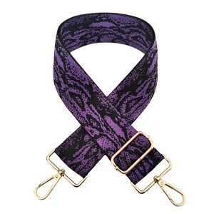 Adjustable wide replacement bag strap with purple and black jacquard pattern and gold hardware
