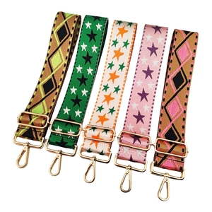 Adjustable crossbody bag straps with star and diamond patterns and gold hardware