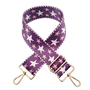 Adjustable purple nylon bag strap with embroidered stars and gold lobster clasps