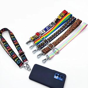 Detail view of colorful patterned phone lanyards with metal buckles and clear connector tabs
