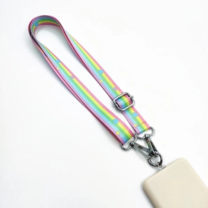 Detail of rainbow striped phone lanyard with star patterns and silver metal buckles