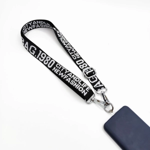 Detail of adjustable black nylon phone lanyard with white text and silver metal hooks