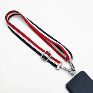 Macro detail of tricolor striped phone lanyard with durable silver metal buckles