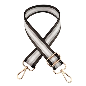 Detail of striped 3.8cm shoulder strap with golden metal hooks and adjustable buckle