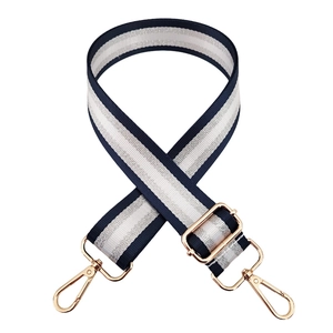 Adjustable navy and silver striped nylon bag strap with gold rotating metal hooks