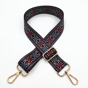 Adjustable wide woven shoulder strap with ethnic embroidery and gold metal clasps