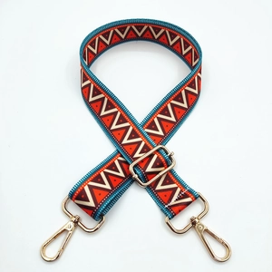 Adjustable ethnic style woven bag strap with geometric patterns and gold metal buckles