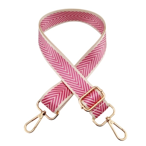 Detail of pink and white chevron pattern woven strap with gold metal lobster clasps