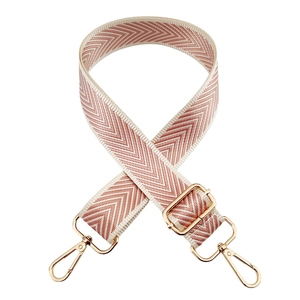 Detail of pink and white chevron woven strap with adjustable gold metallic hardware