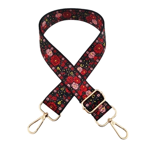 Adjustable floral bag strap with gold metal hooks and ethnic embroidery pattern