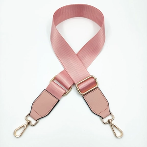 Pink adjustable nylon shoulder strap with leather ends and gold metal hooks for handbags