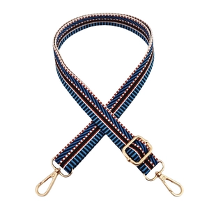 Detail of adjustable 2.5cm colorful geometric woven strap with gold metal lobster clasps
