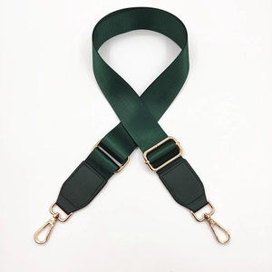 Adjustable dark green nylon shoulder strap with gold metal buckles for crossbody bags