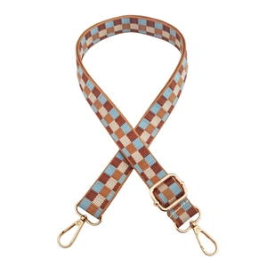 Detail of adjustable checkered weave strap with gold lobster clasps and metal buckle