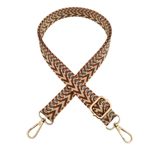 Close-up of bohemian wave patterned adjustable bag strap with golden metal swivel hooks