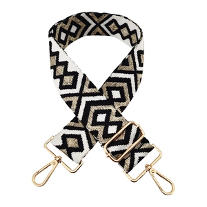 Adjustable geometric embroidery bag strap with gold metal buckles on white background