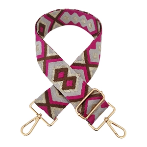 Detail of adjustable bohemian diamond pattern embroidery strap with gold hardware hooks